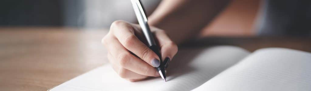 Business woman working at office with documents on his desk, Business woman holding pens and papers making notes in documents on the table, Hands of financial manager taking notes
