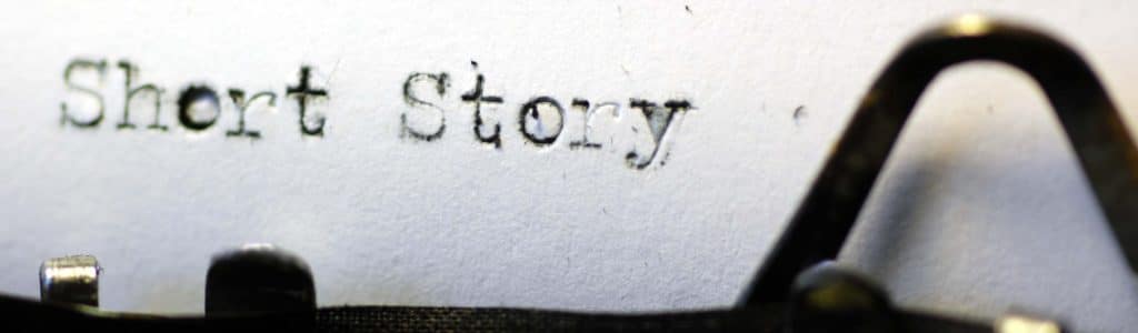 The words 'short story' picked out on a grungy old typewriter. Macro image.
