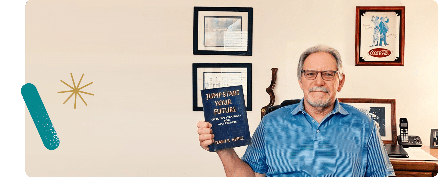 Older man holding a book