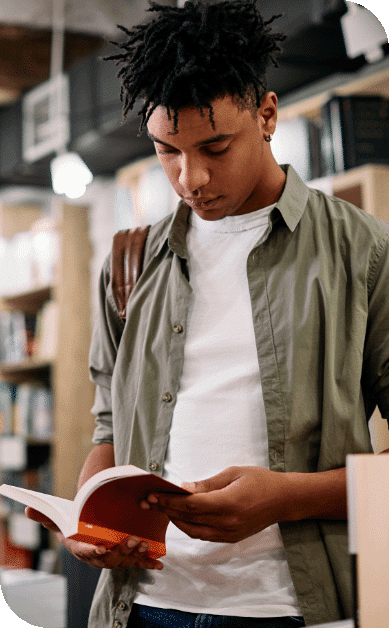 A young man reading a book.