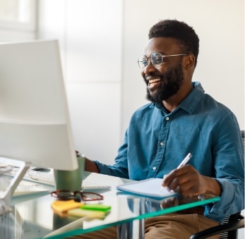 Businessman writing notes in notebook